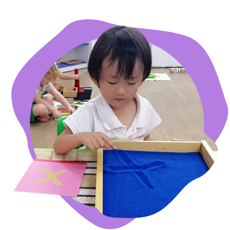 preschool montessori program with sand marking activity